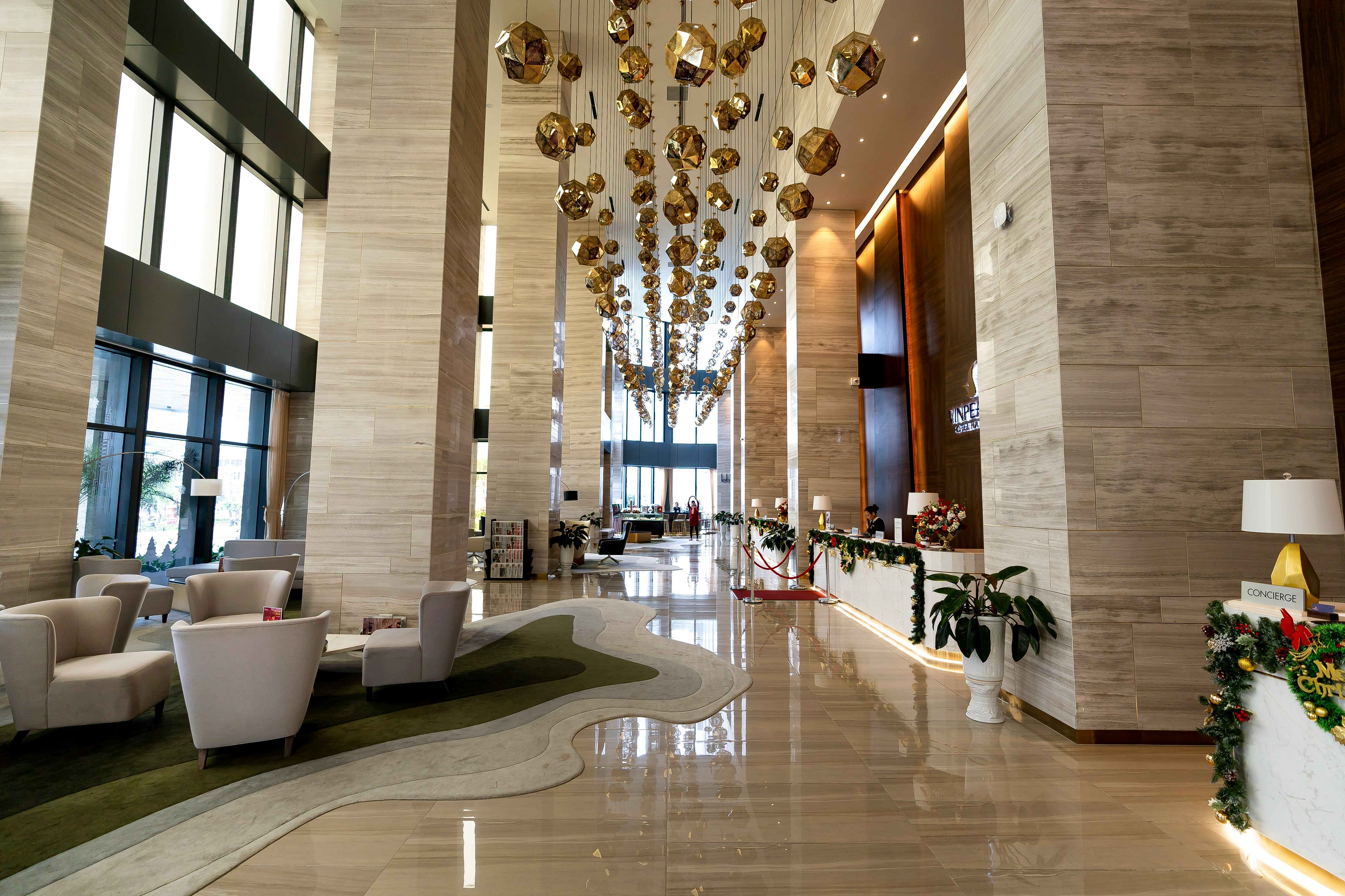 Serenity Grand lobby with marble floors and chandelier